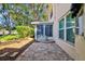 Charming back patio with adjacent sunroom and peaceful seating area at 7802 Hardwick Dr # 1116, New Port Richey, FL 34653