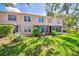 Lush backyard showcasing the sunroom with ample natural light at 7802 Hardwick Dr # 1116, New Port Richey, FL 34653
