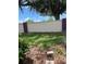 This backyard features a stucco wall and garden space at 7802 Hardwick Dr # 1116, New Port Richey, FL 34653