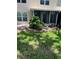 This backyard features a small garden and green grass at 7802 Hardwick Dr # 1116, New Port Richey, FL 34653