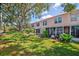 Green backyard and sunroom offers a serene escape at 7802 Hardwick Dr # 1116, New Port Richey, FL 34653