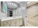 Bathroom featuring vanity with sink, mirror, and medicine cabinet, open to bathtub at 7802 Hardwick Dr # 1116, New Port Richey, FL 34653