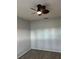 Minimalist bedroom featuring laminate flooring, ceiling fan, and neutral paint at 7802 Hardwick Dr # 1116, New Port Richey, FL 34653