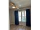 Bedroom with laminate flooring, shutters, and dark curtains at 7802 Hardwick Dr # 1116, New Port Richey, FL 34653