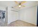 This bedroom has hard floors, a ceiling fan, closet and natural light at 7802 Hardwick Dr # 1116, New Port Richey, FL 34653