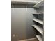 Spacious closet with white shelving providing efficient organization at 7802 Hardwick Dr # 1116, New Port Richey, FL 34653