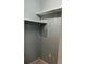 Organized closet with white shelving and ample storage space at 7802 Hardwick Dr # 1116, New Port Richey, FL 34653