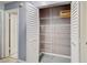 Organized closet with white shelving and bi-fold doors at 7802 Hardwick Dr # 1116, New Port Richey, FL 34653