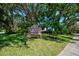 Attractive 'Millpond Estates' community sign surrounded by lush landscaping and mature trees at 7802 Hardwick Dr # 1116, New Port Richey, FL 34653