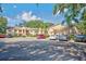 Well maintained two-story condo building with ample parking on a sunny day at 7802 Hardwick Dr # 1116, New Port Richey, FL 34653
