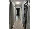 Hallway with laminate flooring and laundry appliances at 7802 Hardwick Dr # 1116, New Port Richey, FL 34653