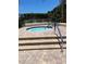 Community hot tub with stairs and a handrail, offering a relaxing space for residents at 7802 Hardwick Dr # 1116, New Port Richey, FL 34653