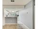Bright kitchen featuring white cabinets, stainless steel appliances, and a breakfast bar overlooking the adjacent living space at 7802 Hardwick Dr # 1116, New Port Richey, FL 34653