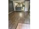 Open-concept living space featuring wood floors connecting to the kitchen area at 7802 Hardwick Dr # 1116, New Port Richey, FL 34653
