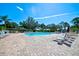 Inviting community pool with lounge chairs and landscaped surroundings, ideal for relaxation and recreation at 7802 Hardwick Dr # 1116, New Port Richey, FL 34653
