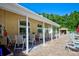 Outdoor patio with seating, sunshades, and views of the pool, perfect for relaxing and entertaining at 7802 Hardwick Dr # 1116, New Port Richey, FL 34653
