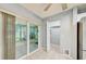 Light-filled sunroom with sliding glass doors to the backyard and an adjacent closet for added storage at 7802 Hardwick Dr # 1116, New Port Richey, FL 34653