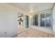 Relaxing sunroom leading into the kitchen with bright, natural light at 7802 Hardwick Dr # 1116, New Port Richey, FL 34653