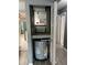 Utility closet featuring water heater, hvac system and storage at 7802 Hardwick Dr # 1116, New Port Richey, FL 34653