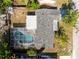 Aerial view of the house featuring a pool and fenced backyard at 7810 Chalafonte Dr, Port Richey, FL 34668