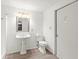 Cozy bathroom with a standing shower, pedestal sink, and toilet at 7810 Chalafonte Dr, Port Richey, FL 34668