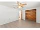 A clean bedroom features wood-look floors and an unique wood closet at 7810 Chalafonte Dr, Port Richey, FL 34668