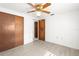 Clean room features ceiling fan, two closets, and natural light at 7810 Chalafonte Dr, Port Richey, FL 34668