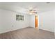 Well-lit room features hard surface floors and a ceiling fan at 7810 Chalafonte Dr, Port Richey, FL 34668