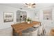 Virtually staged dining room with white walls and plenty of natural light at 7810 Chalafonte Dr, Port Richey, FL 34668