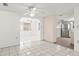 Kitchen with stainless steel appliances, light cabinetry, and tile backsplash at 7810 Chalafonte Dr, Port Richey, FL 34668