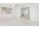 Cozy living room featuring tile floors, natural light, and white walls at 7810 Chalafonte Dr, Port Richey, FL 34668