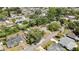 Discover this property from above, nestled within a vibrant neighborhood with mature trees and nearby roads at 7861 Raintree Dr, New Port Richey, FL 34653
