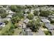 Discover this property from above, nestled within a vibrant neighborhood with mature trees and nearby roads at 7861 Raintree Dr, New Port Richey, FL 34653