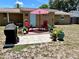 Backyard patio with outdoor seating and mature landscaping at 7861 Raintree Dr, New Port Richey, FL 34653