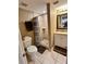 Functional bathroom featuring a vanity with sink, toilet, and walk-in shower at 7861 Raintree Dr, New Port Richey, FL 34653