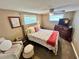 Comfortable bedroom featuring a queen bed, ceiling fan, and neutral decor at 7861 Raintree Dr, New Port Richey, FL 34653