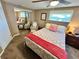 Cozy bedroom with mirrored closet, natural light, and relaxed design at 7861 Raintree Dr, New Port Richey, FL 34653