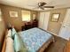 Serene bedroom featuring natural light, desk, and closet access at 7861 Raintree Dr, New Port Richey, FL 34653