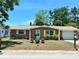 Charming single-story home with a well-maintained front yard and classic curb appeal at 7861 Raintree Dr, New Port Richey, FL 34653