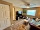 Relaxing living room area with a sleeper sofa, ceiling fan, and a large window at 7861 Raintree Dr, New Port Richey, FL 34653