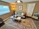 Cozy living room with sleeper sofa, decorative rug and window at 7861 Raintree Dr, New Port Richey, FL 34653