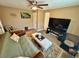 Inviting living room space with sleeper sofa and ample seating at 7861 Raintree Dr, New Port Richey, FL 34653