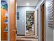 Hallway showing multiple rooms with consistent wood-look flooring throughout the home at 8102 Fort Dade Ave, Brooksville, FL 34601