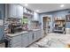 Stylish kitchen with gray cabinets, marble countertops, and stainless steel appliances at 8102 Fort Dade Ave, Brooksville, FL 34601