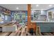 Open kitchen with gray cabinets, mosaic backsplash, and modern appliances at 8102 Fort Dade Ave, Brooksville, FL 34601