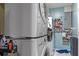 Laundry room featuring a stacked washer and dryer with shelving for storage at 8102 Fort Dade Ave, Brooksville, FL 34601