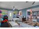 Bright and airy playroom with multiple play areas and a connecting view to the kitchen at 8102 Fort Dade Ave, Brooksville, FL 34601