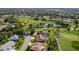 An aerial view of a charming home at 8132 Summersong Ct, Spring Hill, nestled on a beautiful golf course at 8132 Summersong Ct, Spring Hill, FL 34606