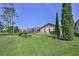 A large backyard, mature trees, and a screened in lanai provide privacy to the home at 8132 Summersong Ct, Spring Hill, FL 34606