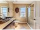 Bathroom with a modern vessel sink, walk-in shower, and a neutral color scheme at 8132 Summersong Ct, Spring Hill, FL 34606